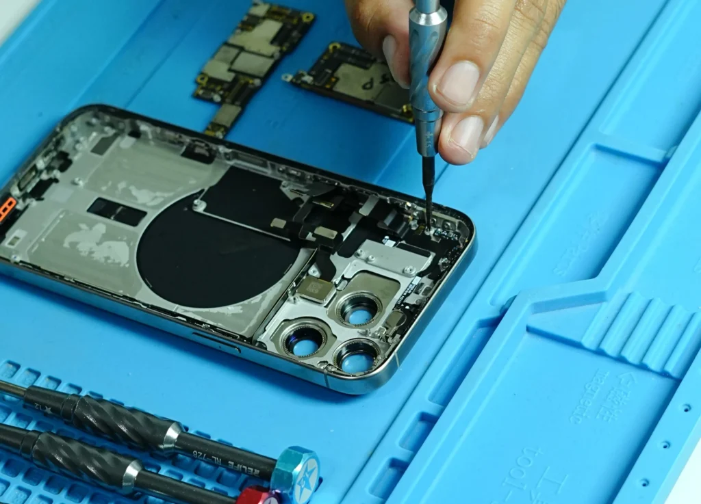 Expert technician at Milaaj performing phone repair Dubai