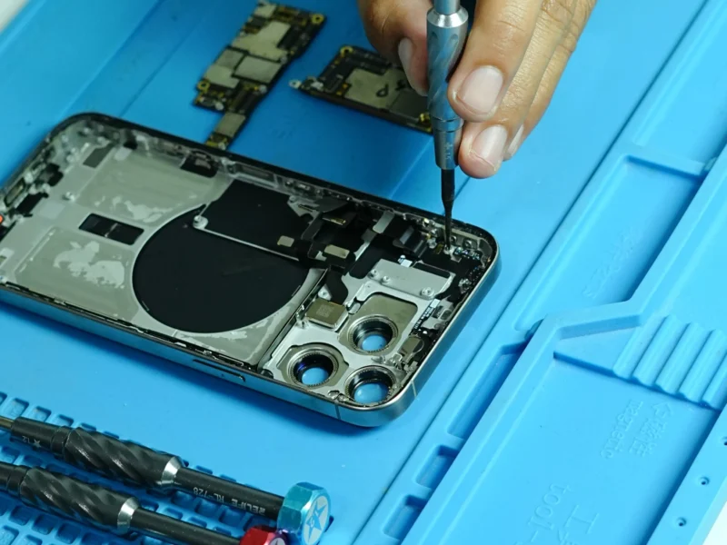 Expert technician at Milaaj performing phone repair Dubai