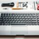 Technician performing laptop keyboard replacement in Dubai with genuine parts