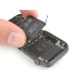 Apple Watch battery replacement process in Ajman showing tools and technician.
