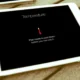 Overheated iPad on a desk with user learning how to cool it down.