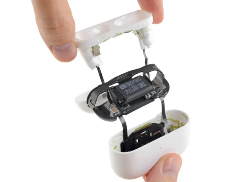 Technician performing Apple AirPods repair in Ajman.