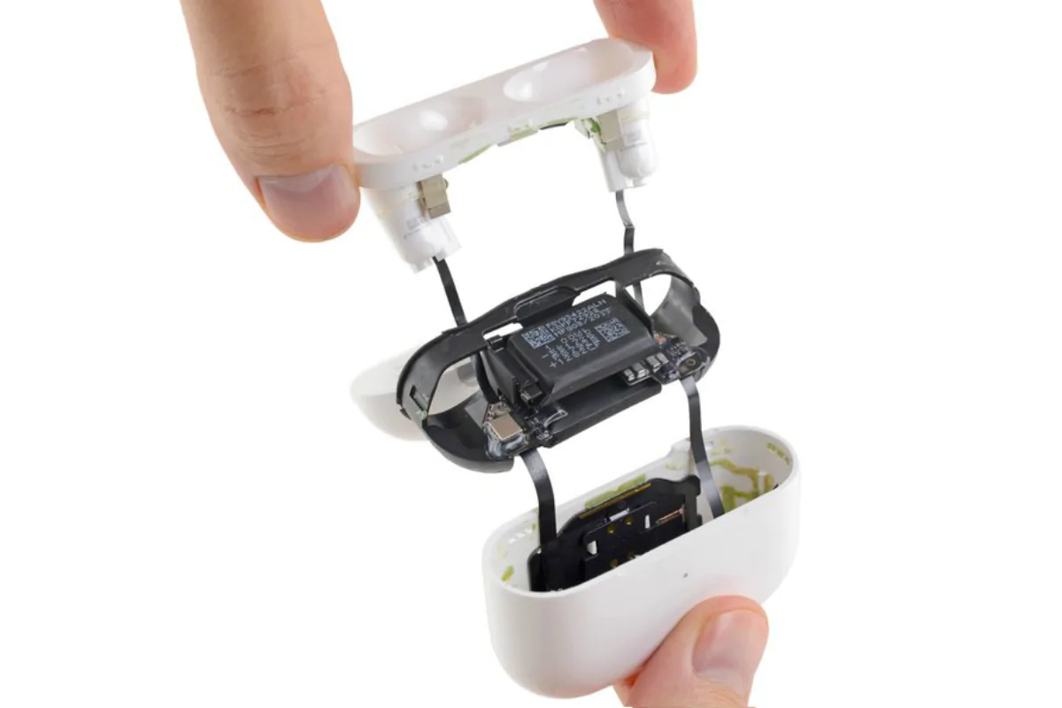 Technician performing Apple AirPods repair in Ajman.