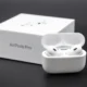 Person cleaning Apple AirPods safely without damaging them using microfiber cloth.