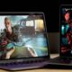 MacBook Air and MacBook Pro side by side used for gaming comparison.