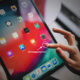 Technician fixing iPad touch screen not responding properly in Dubai