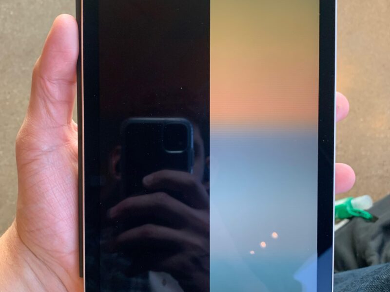 Technician fixing an iPad display that is dim or black in Dubai