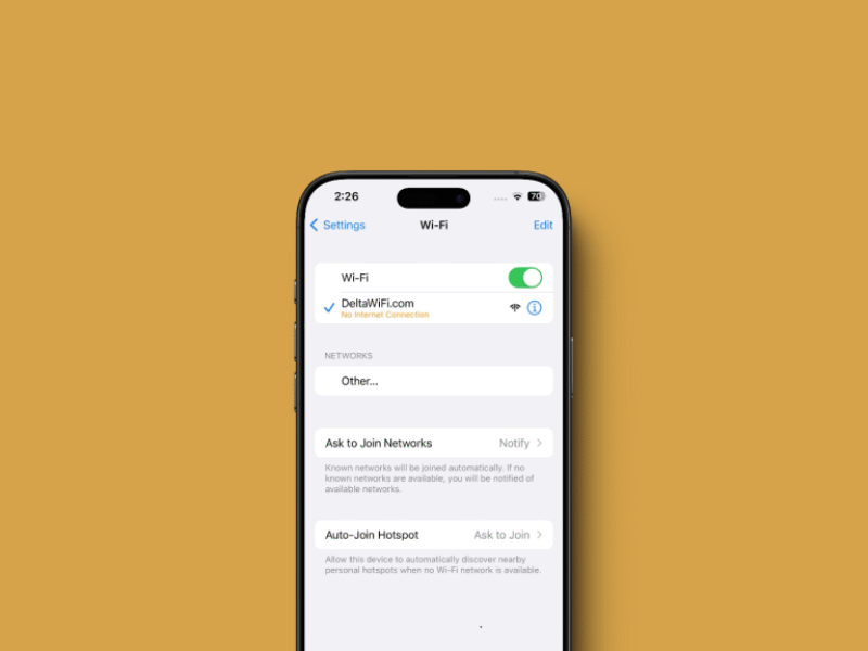 Technician fixing an iPhone Wi-Fi disconnecting issue at a repair center in Dubai.
