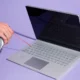 Technician performing laptop cleaning and maintenance in Ajman at Milaaj Mobile and Laptop Repair Dubai.