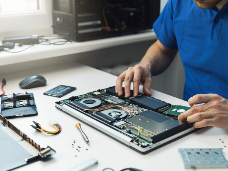 Technician performing regular laptop servicing at Milaaj Mobile and Laptop Repair Dubai.