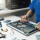 Technician performing regular laptop servicing at Milaaj Mobile and Laptop Repair Dubai.