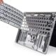 Technician performing MacBook keyboard repair in Ajman using genuine parts