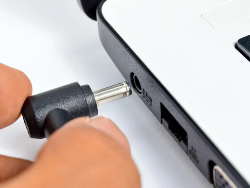 Laptop charging port not working and needing repair.