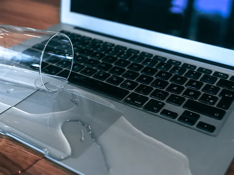 MacBook keyboard not working after liquid spill and needing repair.