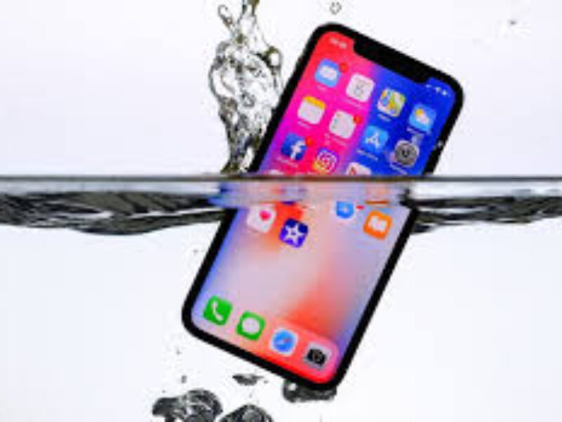 Technician using advanced tools to diagnose water damage inside a smartphone.