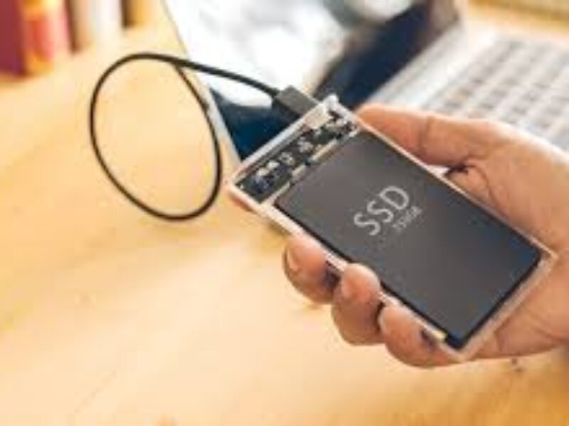 Technician performing external SSD repair & data retrieval